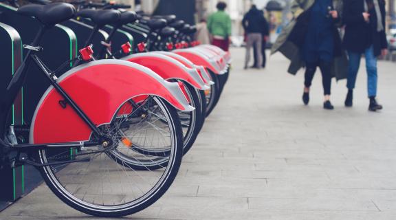 red bikes lined up for bike sharing