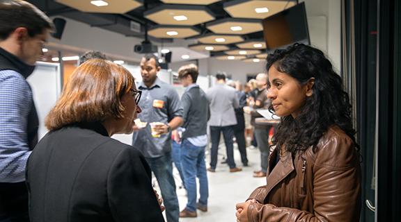student talking with others at a career fair